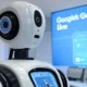 Futuristic robot with Gemini Live video interface on a screen in a modern tech office setting for Google AI 2025.