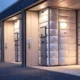 A modern cold storage facility illuminated at dusk, featuring large glass windows and multiple loading docks, with AI-powered sensors and dashboards monitoring temperature and inventory to ensure the safe storage of perishable goods like food, medicines, and flowers.