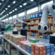 A modern warehouse featuring robotic arms efficiently organizing colorful product boxes on shelves, with real-time data displays in the background, showcasing an optimized storage system in a bustling US warehouse environment.